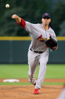 DENVER - SEPTEMBER 25:  Starting pitcher Chris Carpenter #29 of the St. Louis Cardinals delivers against the Colorado Rockies at Coors Field on September 25, 2009 in Denver, Colorado. The Rockies defeated the Cardinals 2-1.  (Photo by Doug Pensinger/Getty
