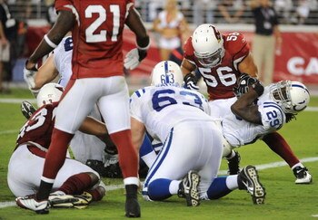 GLENDALE, AZ - SEPTEMBER 27:  Running back Joseph Addai #29 of the Indianapolis Colts scores on a three-yard touchdown catch in the third quarter against the Arizona Cardinals during the game at University of Phoenix Stadium on September 27, 2009 in Glend