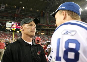 GLENDALE, AZ - SEPTEMBER 27:  Head coach Ken Whisenhunt of the Arizona Cardinals talks with quarterback Peyton Manning #18 of the Indianapolis Colts  after the Colts defeated the Cardinals 31-10 during the game at University of Phoenix Stadium on Septembe