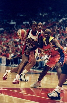 1 Sep 1998:  Guard Cynthia Cooper #14 of the Houston Comets in action against guard Bridget Pettis #32 of the Phoenix Mercury during game three of the WNBA Finals at the Compaq Center in Houston, Texas. The Comets defeated the Mercury 80-71. Mandatory Cre