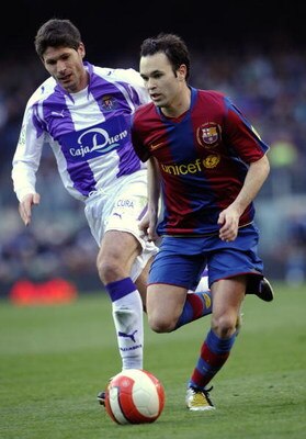 BARCELONA, SPAIN - MARCH 23: Andres Iniesta (R) of Barcelona and Vivar Dorado of Valladolid in action during the La Liga match between Barcelona and Valladolid at the Camp Nou stadium on March 23, 2008 in Barcelona, Spain.  (Photo by Manuel Queimadelos Al