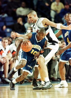 17 Mar 2000: Craig Claxton #10 of Hofstra drives past Joe Adkins #35 of Oklahoma St during the NCAA East Regional first round game at the HSBC Arena in Buffalo, New York.