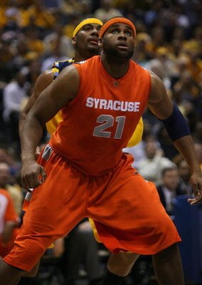 MILWAUKEE - MARCH 07: Arinze Onuaku #21 of the Syracuse Orange boxes out Lazar Hayward #32 of the Marquette Golden Eagles on March 7, 2009 at the Bradley Center in Milwaukee, Wisconsin. Syracuse defeated Marquette 86-79 in overtime. (Photo by Jonathan Dan