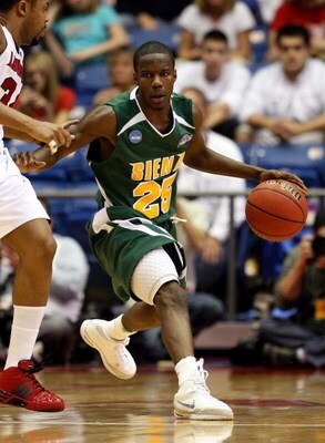 DAYTON, OH - MARCH 22: Ronald Moore #23 of the Siena Saints handles the ball against the Louisville Cardinals during the second round of the NCAA Division I Men's Basketball Tournament at the University of Dayton Arena on March 22, 2009 in Dayton, Ohio.  