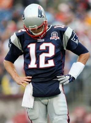 FOXBORO, MA - SEPTEMBER 27:  Quarterback Tom Brady #12 of the New England Patriots reacts to a play in the third quarter of the game against the Atlanta Falcons at Gillette Stadium on September 27, 2009 in Foxboro, Massachusetts.  (Photo by Elsa/Getty Ima