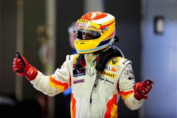 SINGAPORE - SEPTEMBER 27:  Fernando Alonso of Spain and Renault celebrates in parc ferme after finishing third during the Singapore Formula One Grand Prix at the Marina Bay Street Circuit on September 27, 2009 in Singapore.  (Photo by Clive Mason/Getty Im