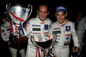BRASELTON, GA - SEPTEMBER 26:  Franck Montagny (L) and Stephane Sarrazin, drivers of the #08 Team Peugeot Total Peugeot 908 HDI celebrate after winning the American Le Mans Series Petit Le Mans on September 26, 2009 at Road Atlanta in Braselton Georgia.  