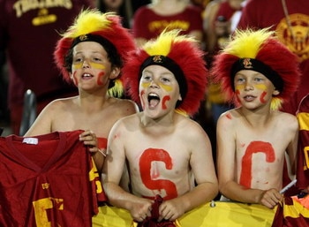 LOS ANGELES - SEPTEMBER 23:  Young USC Trojans fans yell in the game with the Washingotn State Cougars on September 23, 2009 at the Los Angeles Coliseum in Los Angeles, California.    (Photo by Stephen Dunn/Getty Images)