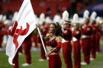 ATLANTA - SEPTEMBER 05:  A flag girl for the Alabama Crimson Tide marching band performs before the game against the Virginia Tech Hokies during the Chick-fil-A Kickoff Game at Georgia Dome on September 5, 2009 in Atlanta, Georgia.  (Photo by Kevin C. Cox