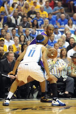 ORLANDO, FL - JUNE 14:  Kobe Bryant #24 of the Los Angeles Lakers looks to move the ball against Courtney Lee #11 of the Orlando Magic in Game Five of the 2009 NBA Finals on June 14, 2009 at Amway Arena in Orlando, Florida. The Lakers won 99-86.  NOTE TO 