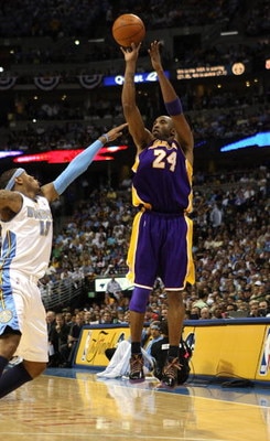 DENVER - MAY 25:  Kobe Bryant #24 of the Los Angeles Lakers shoots against Carmelo Anthony #15 of the Denver Nuggets in Game Four of the Western Conference Finals during the 2009 NBA Playoffs at Pepsi Center on May 25, 2009 in Denver, Colorado. NOTE TO US