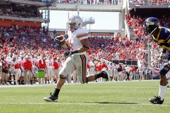 CLEVELAND - SEPTEMBER 19: Dan Herron #1 of the Ohio State Buckeyes carries the ball during the game against the Toledo Rockets at Cleveland Browns Stadium on September 19, 2009 in Cleveland, Ohio. The Ohio State Buckeyes shutout the Toledo Rockets 38-0. (