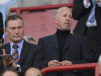 BIRMINGHAM, UNITED KINGDOM - OCTOBER 14:  Villa chairman Randy Lerner (r) takes his seat during the Barclays Premiership match between Aston villa and Tottenham Hotspur at Villa Park on October 14, 2006 in Birmingham, England.  (Photo by Stu Forster/Getty