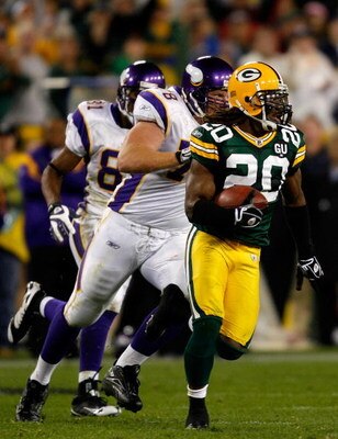 GREEN BAY, WI - SEPTEMBER 08:  Atari Bigby #20 of the Green Bay Packers runs the ball after an interception in the final minute of the game against the Minnesota Vikings on September 8, 2008 at Lambeau Field in Green Bay, Wisconsin.  (Photo by Dilip Vishw