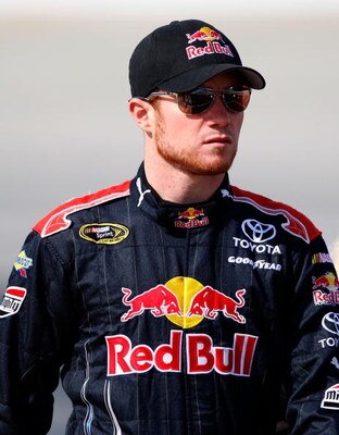 DOVER, DE - SEPTEMBER 25:  Brian Vickers, driver of the #83 Red Bull Toyota, walks to his car during qualifying for the NASCAR Sprint Cup Series AAA 400 at Dover International Speedway on September 25, 2009 in Dover, Delaware.  (Photo by Geoff Burke/Getty