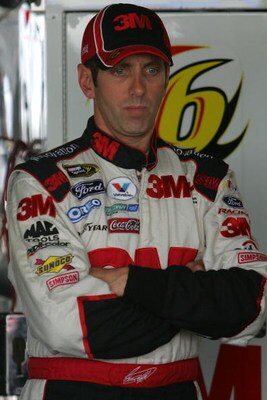 DOVER, DE - SEPTEMBER 26:  Greg Biffle, driver of the #16 3M Ford, stands in his car during practice for the NASCAR Sprint Cup Series AAA 400 at Dover International Speedway on September 26, 2009 in Dover, Delaware.  (Photo by Chris Trotman/Getty Images)