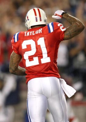 FOXBORO, MA - SEPTEMBER 14: Fred Taylor #21 of the New England Patriots celebrates a touchdown during the game against the Buffalo Bills on September 14, 2009 at Gillette Stadium in Foxboro, Massachusetts. (Photo by Elsa/Getty Images)