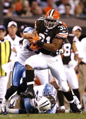 CLEVELAND - AUGUST 29:  Jamal Lewis #31 of the Cleveland Browns runs through the defense of the Tennessee Titans at Cleveland Browns Stadium on August 29, 2009 in Cleveland, Ohio.  (Photo by Matt Sullivan/Getty Images)