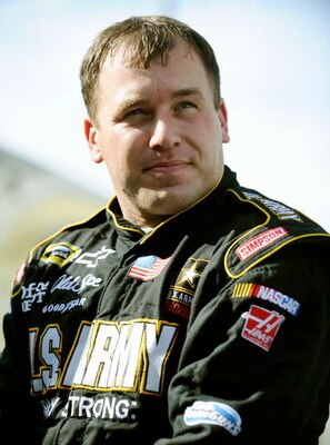 DOVER, DE - SEPTEMBER 25:  Ryan Newman, driver of the #39 U.S.Army Chevrolet climbs out of his car during qualifying for the NASCAR Sprint Cup Series AAA 400 at Dover International Speedway on September 25, 2009 in Dover, Delaware.  (Photo by Jeff Zelevan