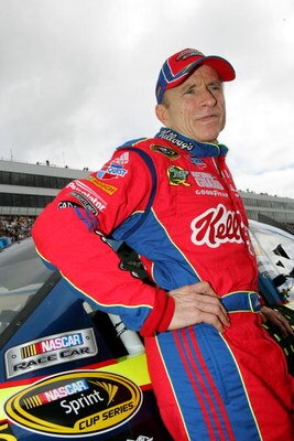 DOVER, DE - SEPTEMBER 27:  Mark Martin, driver #5 of the Kellogg's/CARQUEST Chevrolet, waits by his car before the NASCAR Sprint Cup Series AAA 400 at Dover International Speedway on September 27, 2009 in Dover, Delaware.  (Photo by Todd Warshaw/Getty Ima