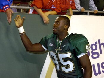 TAMPA, FL - NOVEMBER 17: Defensive end George Selvie #95 of the University of South Florida Bulls greets fans after play against the Louisville Cardinals at Raymond James Stadium on November 17, 2007 in Tampa, Florida.  South Florida won 55-17.  (Photo by