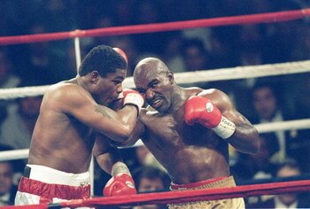 4 Nov 1995:  Riddick Bowe (left) and Evander Holyfield III trade blows during a bout at Caesar''s Palace in Las Vegas, Nevada.  Bowe won the fight with a technical knockout in the eighth round. Mandatory Credit: Holly Stein  /Allsport