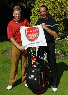 SUNNINGDALE, ENGLAND - SEPTEMBER 6:  Ian Poulter (L) of England poses with former England goalkeeper David Seaman as they hold an Arsenal towel at the inaugural TAG Heuer LINK Challenge at Sunningdale Golf Club on September 6, 2004 in Sunningdale, England