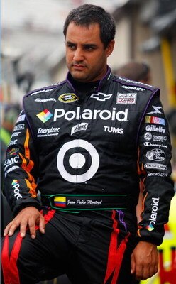 DOVER, DE - SEPTEMBER 26:  Juan Pablo Montoya, driver of the #42 Polaroid Chevrolet, waits in the garage area during practice for the NASCAR Sprint Cup Series AAA 400 at Dover International Speedway on September 26, 2009 in Dover, Delaware.  (Photo by Geo