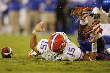LEXINGTON, KY - SEPTEMBER 26: Quarterback Tim Tebow #15 of the Florida Gators lays on the ground after being sacked by Taylor Wyndham #94 of the Kentucky Wildcats during the third quarter of the game at Commonwealth Stadium on September 26, 2009 in Lexing