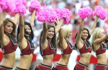 TAMPA, FL - OCTOBER 12: Cheerleaders of the Tampa Bay Buccaneers carry pink pom pons to promote breast cancer awareness  against the Carolina Panthers at Raymond James Stadium on October 12, 2008 in Tampa, Florida.  (Photo by Al Messerschmidt/Getty Images