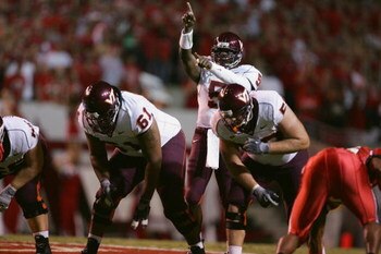 RALEIGH, NC - SEPTEMBER 4:  Quarterback Marcus Vick #5 of the Virginia Polytechnic Institute and State University Hokies calls a play during the game against the North Carolina State University Wolfpack at Carter-Finley Stadium on September 4, 2005 in Ral