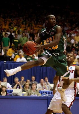 DAYTON, OH - MARCH 22: Ronald Moore #25 of the Siena Saints handles the ball against the Louisville Cardinals during the second round of the NCAA Division I Men's Basketball Tournament at the University of Dayton Arena on March 22, 2009 in Dayton, Ohio.  