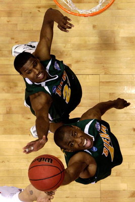DAYTON, OH - MARCH 20: Alex Franklin #42 and Edwin Ubiles #23 of the Siena Saints go for a rebound against the Ohio State Buckeyes during the first round of the NCAA Division I Men's Basketball Tournament at the University of Dayton Arena on March 20, 200