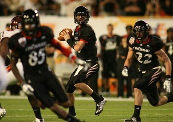 MIAMI - JANUARY 01: Tony Pike #15 of the Cincinnati Bearcats looks down field to pass against the Virginia Tech Hokies during the FedEx Orange Bowl at Dolphin Stadium on January 1, 2009 in Miami, Florida.  (Photo by Marc Serota/Getty Images)