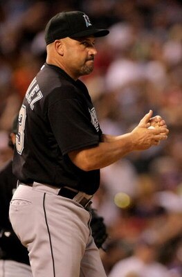 DENVER - JULY 03:  Manager Fredi Gonzalez #33 of the Florida Marlins makes a pitching change during action against  the Colorado Rockies at Coors Field on July 3, 2008 in Denver, Colorado. The Rockies defeated the Marlins 6-5 in 11 innings.  (Photo by Dou