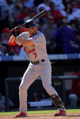 DENVER - SEPTEMBER 27:  Mark DeRosa #7 of the St. Louis Cardinals takes an at bat against the Colorado Rockies at Coors Field on September 27, 2009 in Denver, Colorado. The Rockies defeated the Cardinals 4-3.  (Photo by Doug Pensinger/Getty Images)