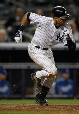 NEW YORK - SEPTEMBER 29:  Derek Jeter #2 of the New York Yankees runs to first base on a single and his 200th of the season against the Kansas City Royals during the game on September 29, 2009 at Yankee Stadium in the Bronx borough of New York City.  (Pho