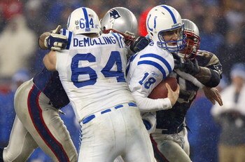 FOXBORO, MA - JANUARY 18:  Linebacker Willie McGinest #55 and teammate Richard Seymour #93 of the New England Patriots sack quarterback Peyton Manning #18 of the Indianapolis Colts as offensive lineman Rick DeMulling #64 blocks in the AFC Championship Gam