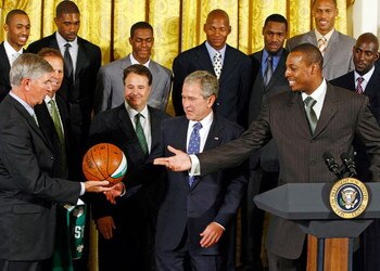 WASHINGTON - SEPTEMBER 19:  U.S. President George W. Bush (C) is presented an autographed basketball from the National Basketball Association champion Boston Celtics including (front row L-R) managing partners Irving Grousbeck and Steve Pagliuca; players 