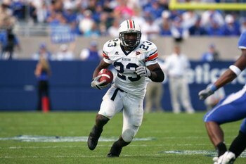 LEXINGTON, KY - NOVEMBER 5:  Running back Kenny Irons #23 of the Auburn Tigers carries the ball against the Kentucky Wildcats during the game on November 5, 2005 at Commonwealth Stadium in Lexington, Kentucky. Auburn won the game 49-27. (Photo by Andy Lyo