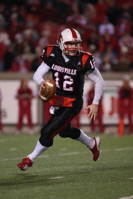 LOUISVILLE, KY - NOVEMBER 29:  Brian Brohm #12 of the Louisville Cardinals rolls out to pass during the Big East Conference game against the Rutgers Scarlet Knights on November 29, 2007 at Papa John's Stadium. (Photo by Andy Lyons/Getty Images)