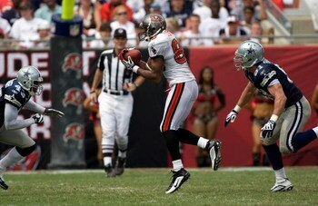 TAMPA, FL - SEPTEMBER 13:  Receiver Michael Clayton #80 of the Tampa Bay Buccaneers catches the ball over the middle against the Dallas Cowboys during the game at Raymond James Stadium on September 13, 2009 in Tampa, Florida.  (Photo by J. Meric/Getty Ima