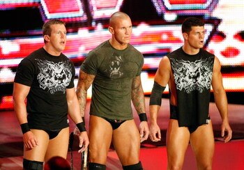 LAS VEGAS - AUGUST 24:  (L-R) Wrestlers Ted DiBiase, Randy Orton and Cody Rhodes appear during the WWE Monday Night Raw show at the Thomas & Mack Center August 24, 2009 in Las Vegas, Nevada.  (Photo by Ethan Miller/Getty Images)
