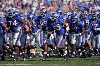 LAWRENCE, KS - SEPTEMBER 19: The Kansas Jayhawks jog onto the field before the game against the Duke Blue Devils on Kivisto Field at Memorial Stadium on September 19, 2009 in Lawrence, Kansas. (Photo by Jamie Squire/Getty Images)