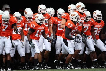 STILLWATER, OK - SEPTEMBER 05:  The Oklahoma State Cowboys run out onto the field before the college football game at Boone Pickens Stadium on September 5, 2009 in Stillwater, Oklahoma.  The Cowboys defeated the Bulldogs 24-10.  (Photo by Christian Peters