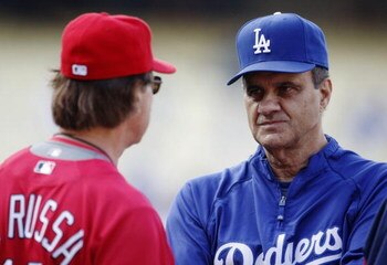 LOS ANGELES, CA - AUGUST 19:  Manager Joe Torre of the Los Angeles Dodgers talks to Manager Tony La Russa of the St. Louis Cardinals prior to the game at Dodger Stadium on August 19, 2009 in Los Angeles, California.  (Photo by Jeff Gross/Getty Images)