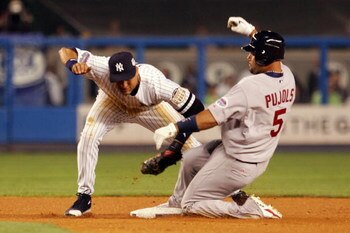 NEW YORK - JULY 15:  American League All-Star  Derek Jeter #2 of the New York Yankees tags out National League All-Star Albert Pujols #5 of the St. Louis Cardinals during the 79th MLB All-Star Game at Yankee Stadium on July 15, 2008 in the Bronx borough o
