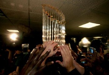 HOUSTON - OCTOBER 26:  The Championship trophy is passed around the Chicago White Sox locker room after winning Game Four of the 2005 Major League Baseball World Series against the Houston Astros at Minute Maid Park on October 26, 2005 in Houston, Texas. 