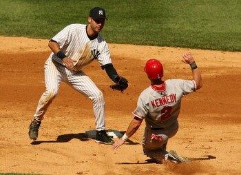 NEW YORK - AUGUST 13:  Derek Jeter #2 of the New York Yankees tags out Adam Kennedy #2 of the Los Angeles Angels of Anaheim at second August 13, 2006 at Yankee Stadium in the Bronx borough of New York City.  (Photo by Nick Laham/Getty Images)