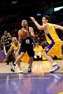LOS ANGELES, CA - MAY 29:  Tony Parker #9 of the San Antonio Spurs goes to the basket in between Derek Fisher #2 and Luke Walton #4 of the Los Angeles Lakers in Game Five of the Western Conference Finals during the 2008 NBA Playoffs on May 29, 2008 at Sta